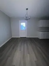 a view of room with a ceiling fan and window