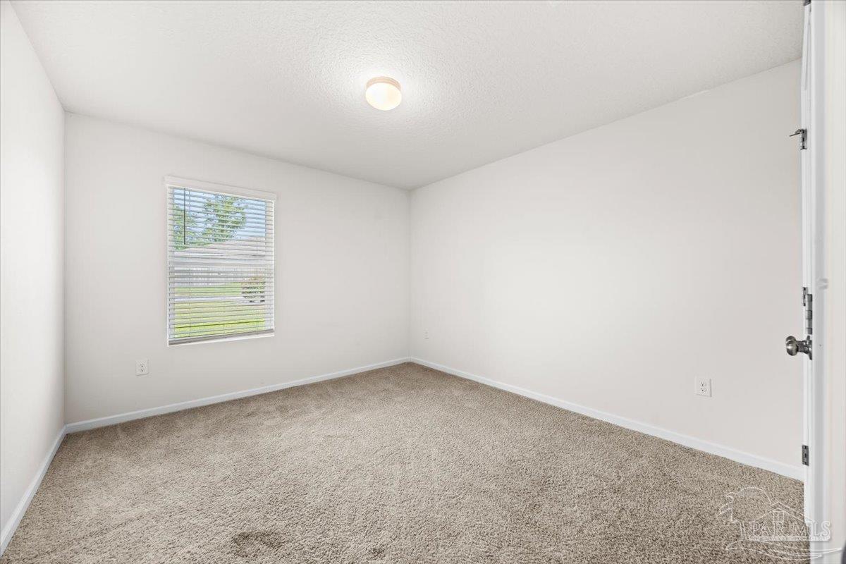 4666 Perception Circle Milton, FL 32570 - Photo 11 of 36 an empty room with a window