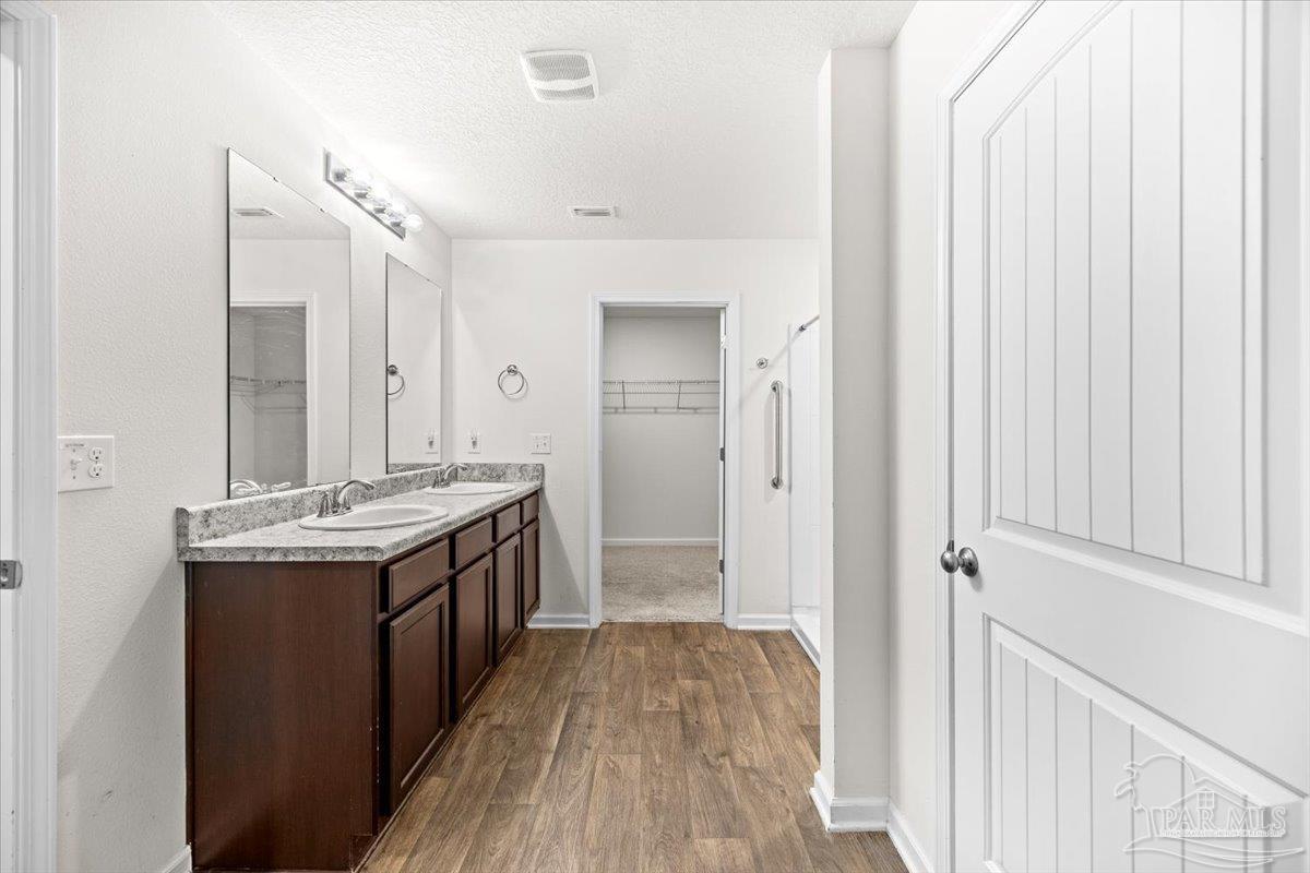 4666 Perception Circle Milton, FL 32570 - Photo 19 of 36 a view of bathroom with a sink and mirror