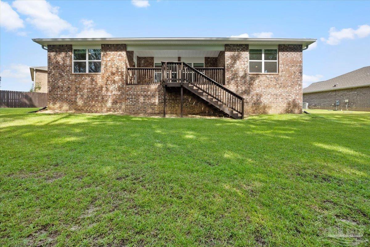 4666 Perception Circle Milton, FL 32570 - Photo 25 of 36 front view of a house with a yard