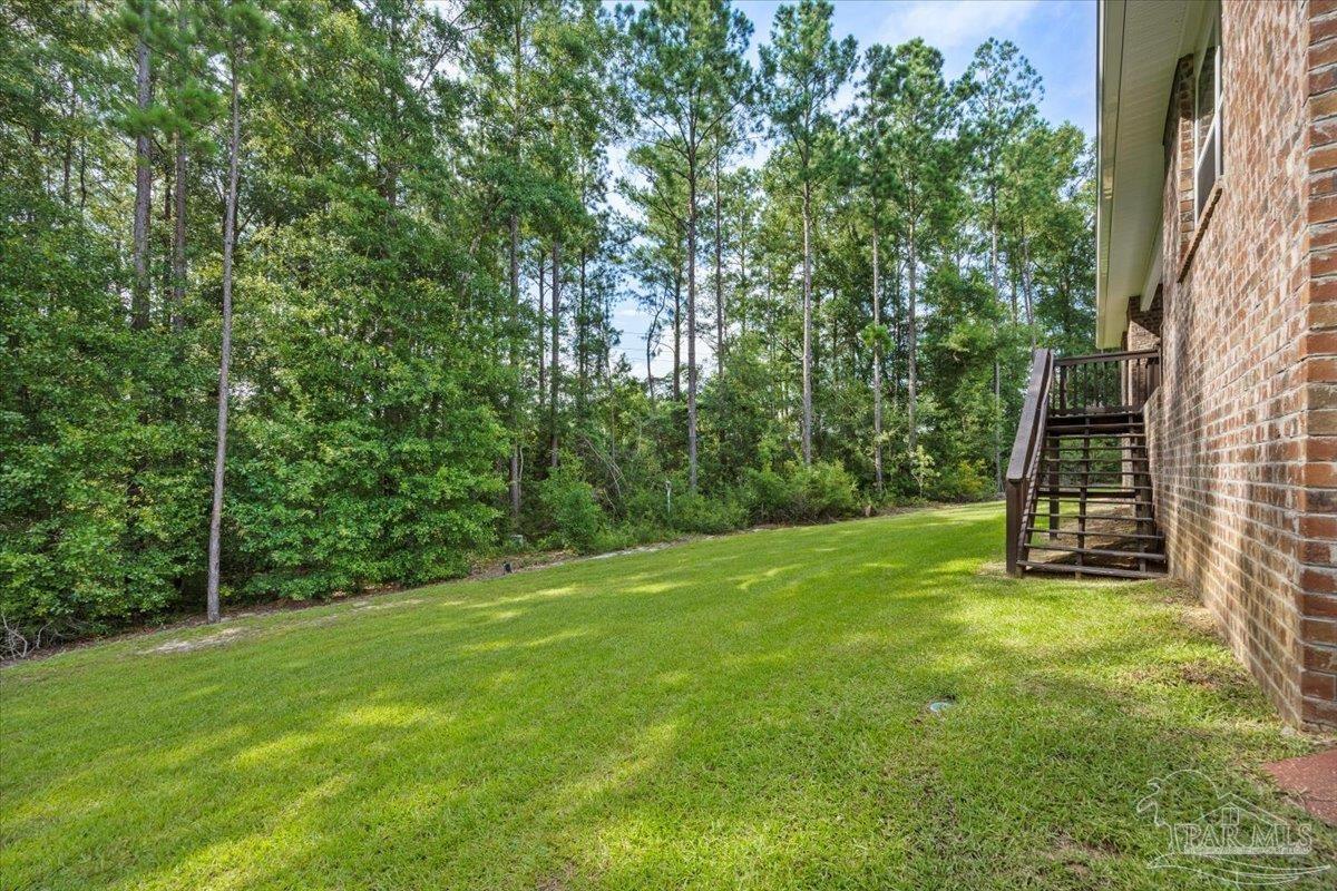 4666 Perception Circle Milton, FL 32570 - Photo 26 of 36 a view of a field with a tree