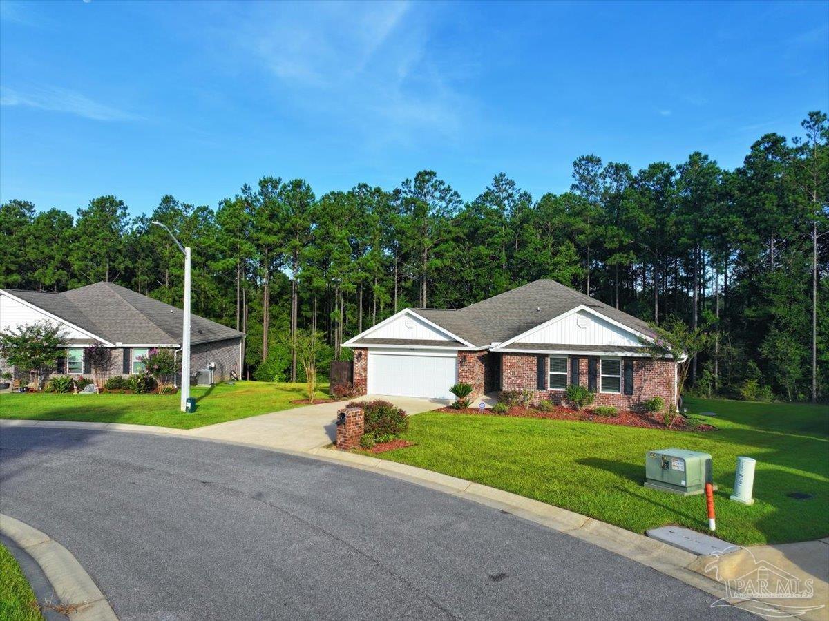 4666 Perception Circle Milton, FL 32570 - Photo 28 of 36 a front view of a house with a yard