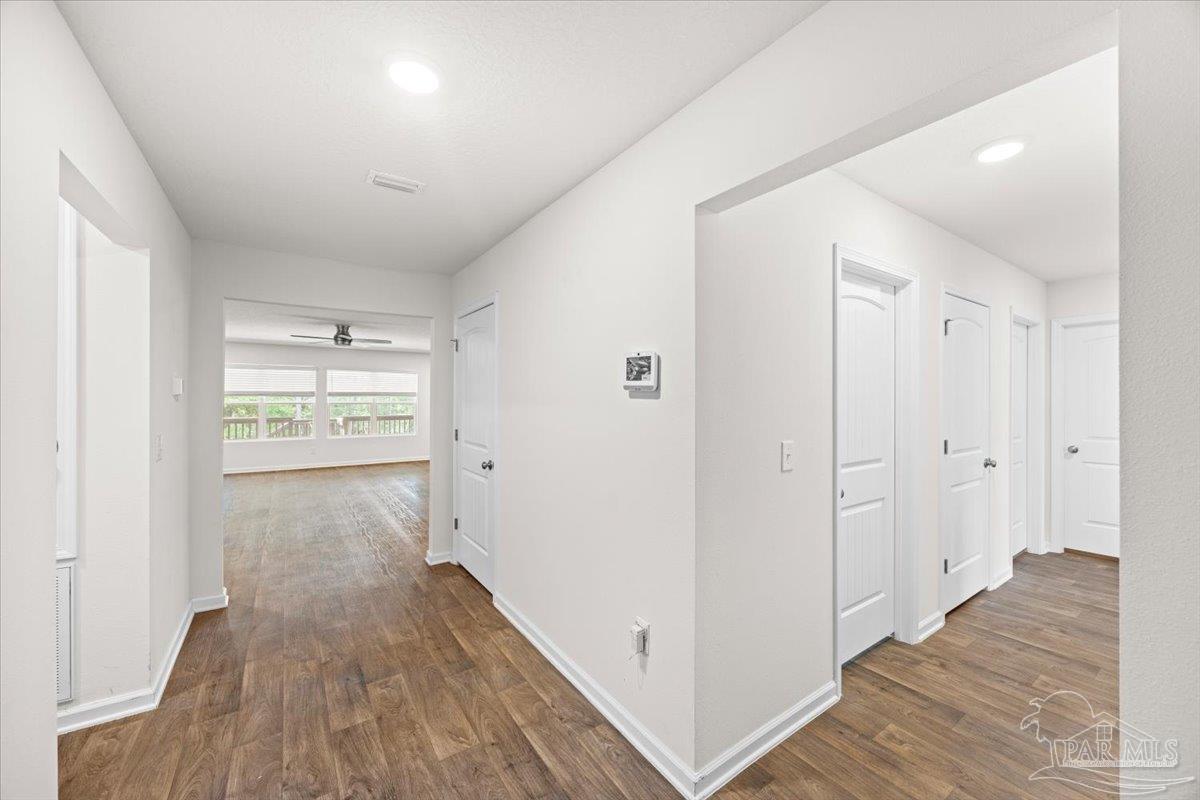 4666 Perception Circle Milton, FL 32570 - Photo 5 of 36 a view of hallway with wooden floor