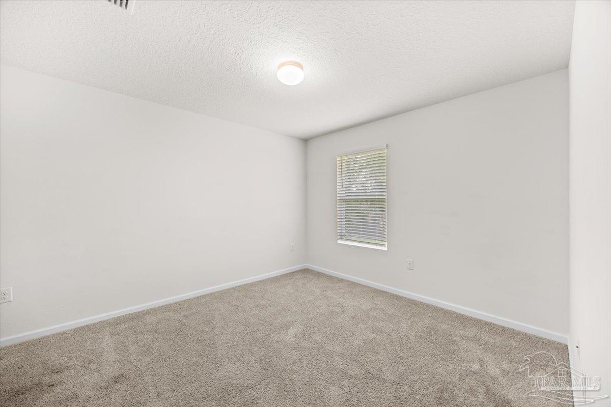 4666 Perception Circle Milton, FL 32570 - Photo 7 of 36 an empty room with a window