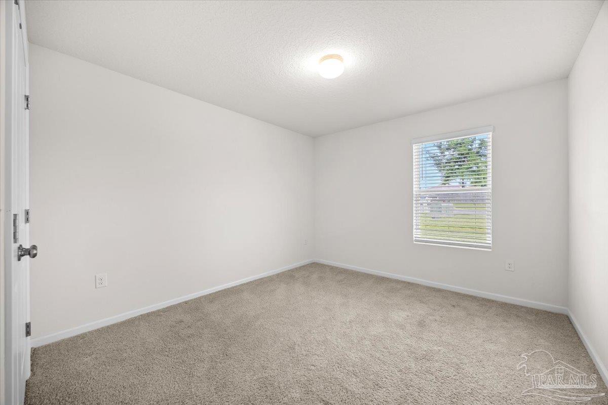 4666 Perception Circle Milton, FL 32570 - Photo 10 of 36 an empty room with a window