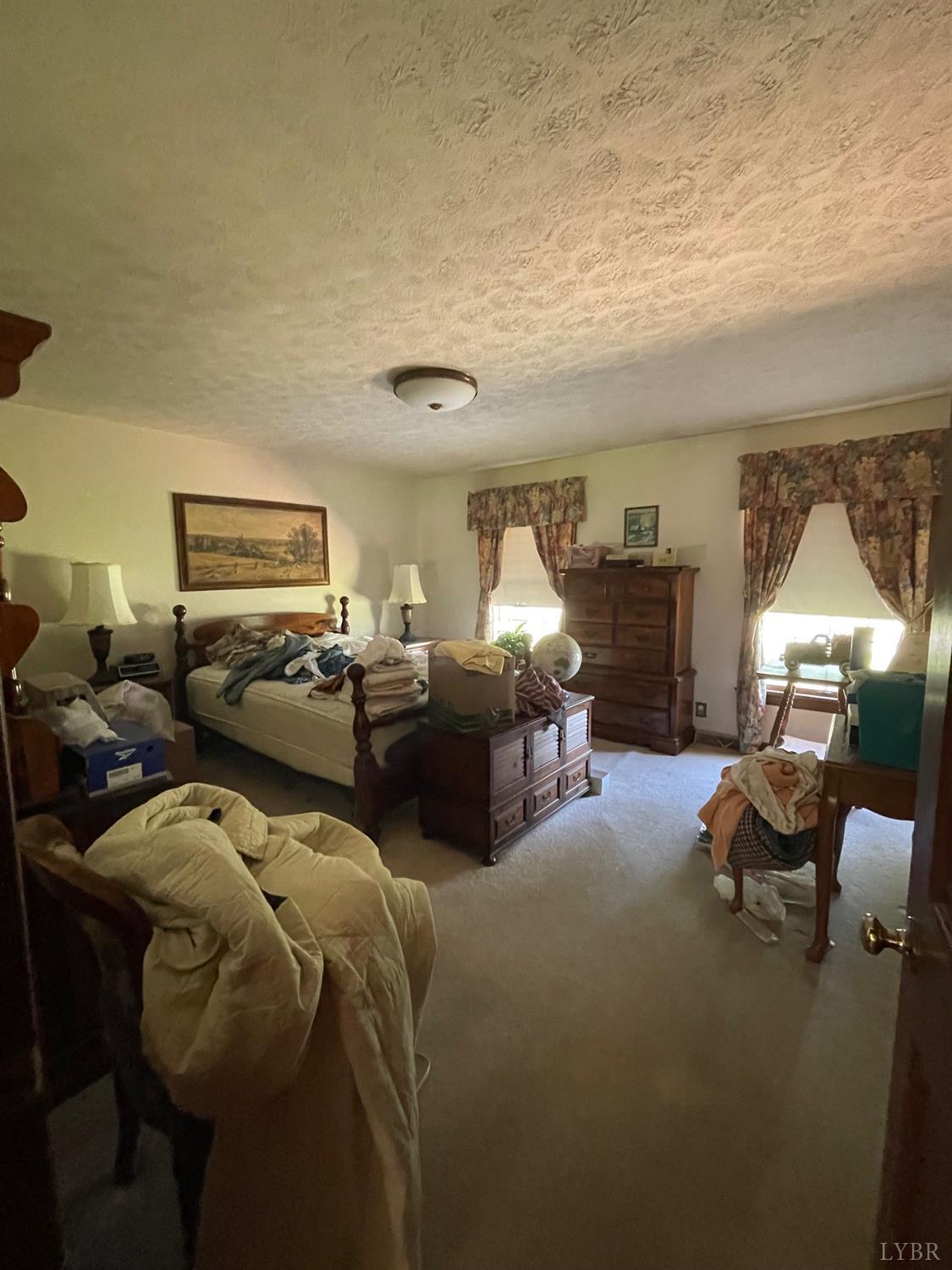 389 Homeplace Road Rustburg, VA 24588 - Photo 10 of 20 a living room with furniture and a lamp
