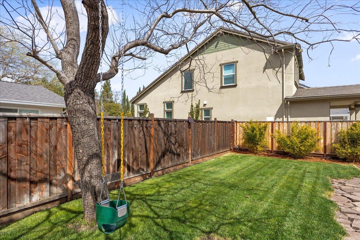 1858 Lambeth Lane Concord, CA 94518 - Photo 44 of 57 a view of backyard with wooden fence and a large tree