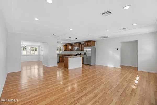 a view of kitchen with cabinets and wooden floor