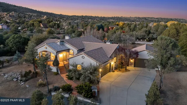 a front view of a house with a garage
