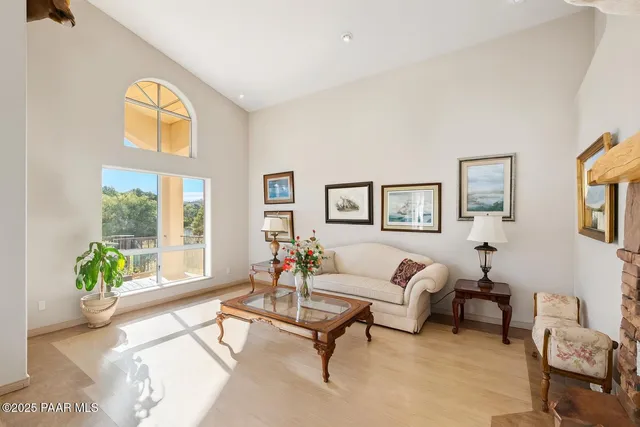 a bedroom with a bed and dresser with mirror