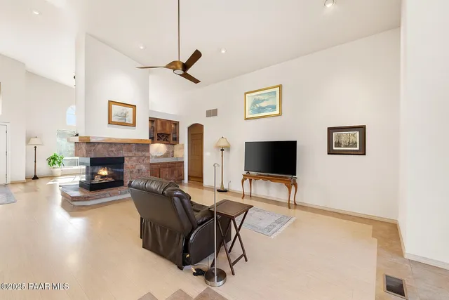 a bathroom with a bathtub shower sink vanity and toilet