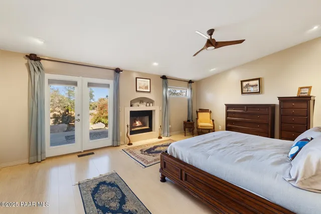 a view of a large tree in front of a house