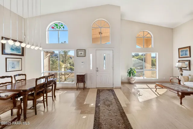 a kitchen with stainless steel appliances granite countertop a stove refrigerator and cabinets