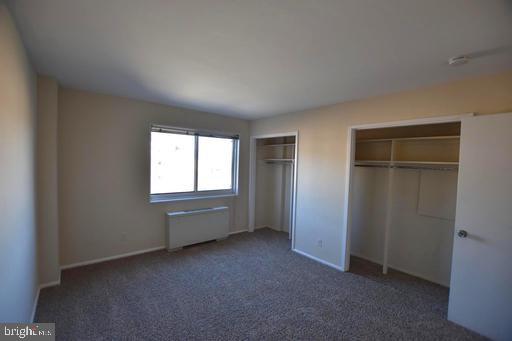 4313 Knox Road, Unit 501 College Park, MD 20740 - Photo 13 of 17 an empty room with windows and closet