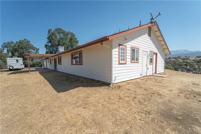a view of a house with a yard and garage