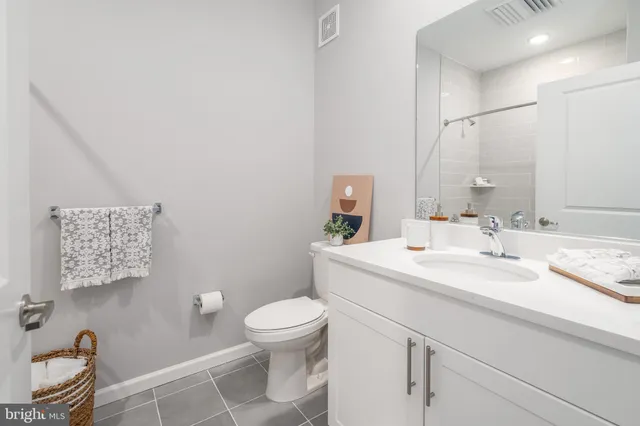 a bathroom with a sink toilet and vanity