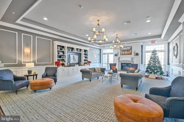 a living room with furniture a chandelier and a chandelier