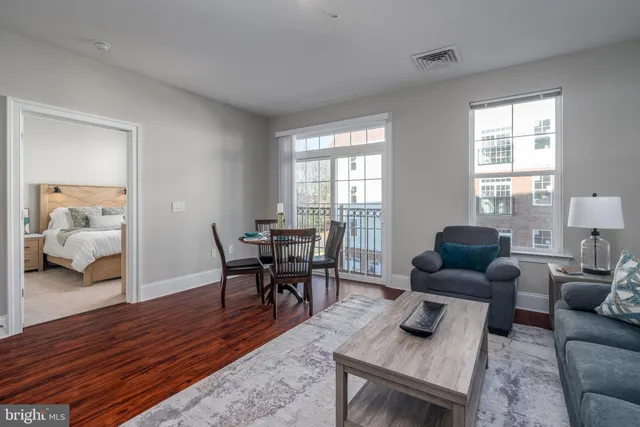 a living room with furniture and a table