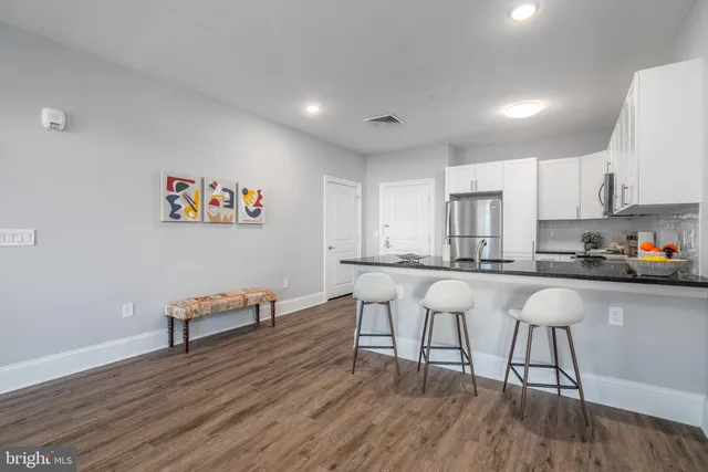 a kitchen with a table and chairs in it