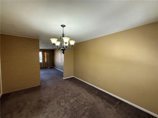 a view of a kitchen with a chandelier