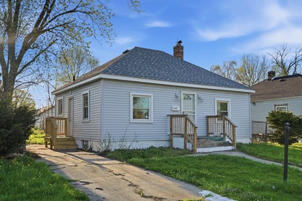 560 Ralston Street Gary, IN 46406 - Photo 2 of 11 a view of a house with a yard