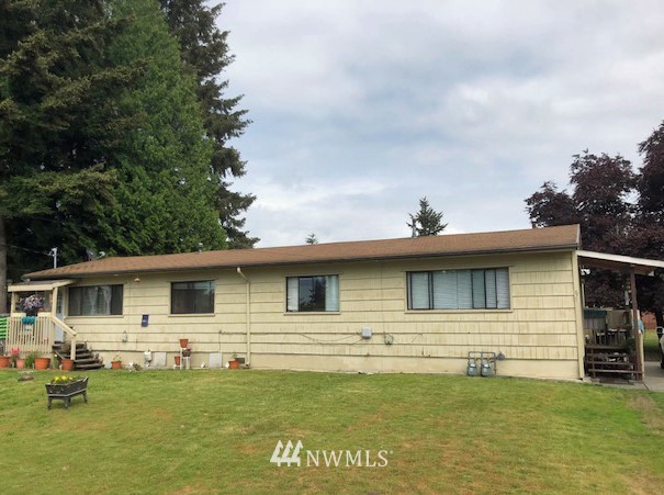 a front view of a house with swimming pool