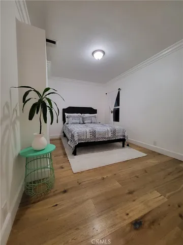 a kitchen with kitchen island a stove a microwave and a refrigerator