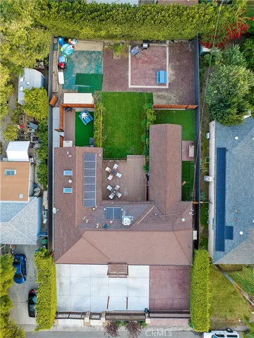 an aerial view of multiple houses with yard