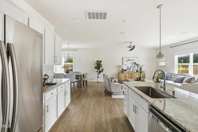 a view of a swimming pool with outdoor seating