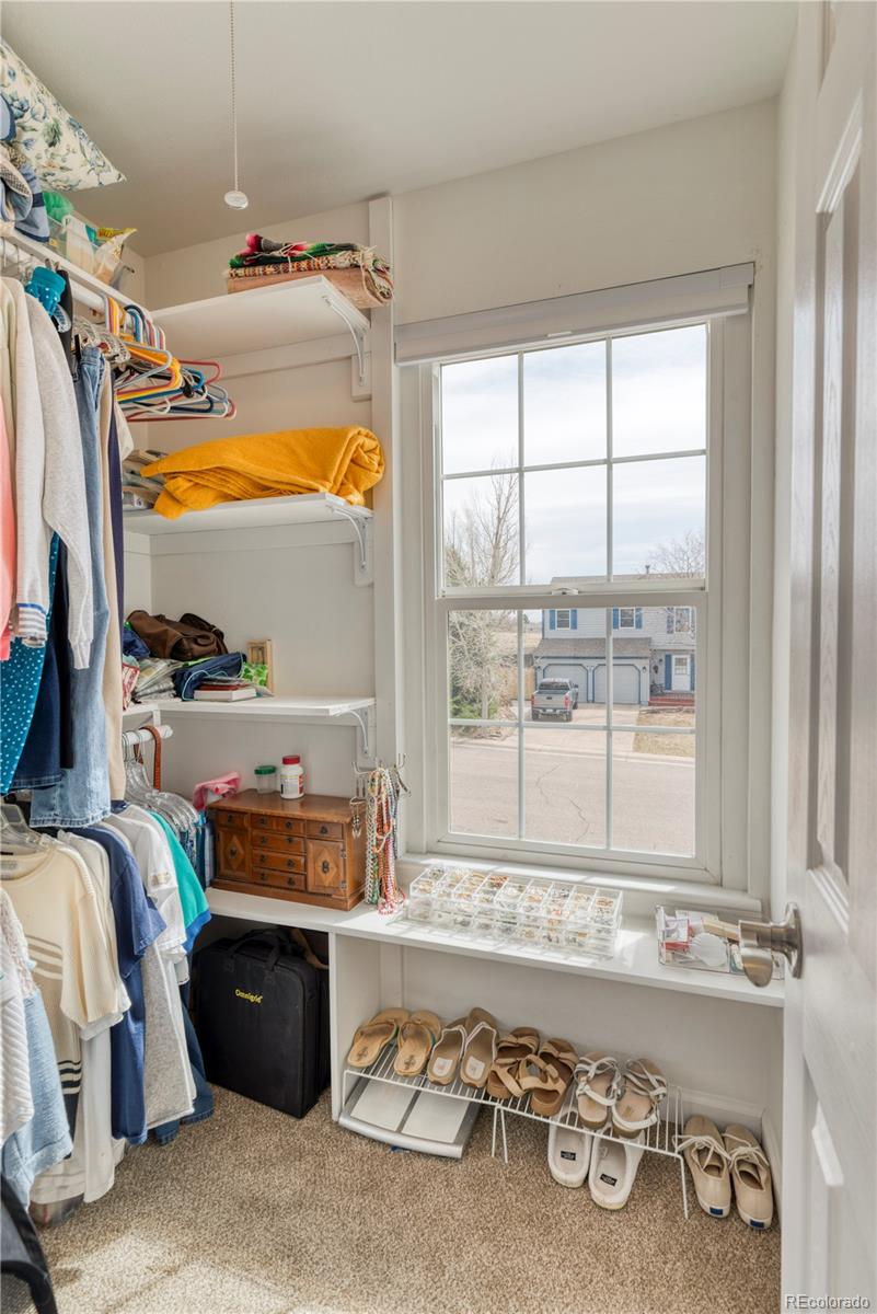 6723 East Rustic Drive Parker, CO 80138 - Photo 21 of 32 a room with furniture and a window