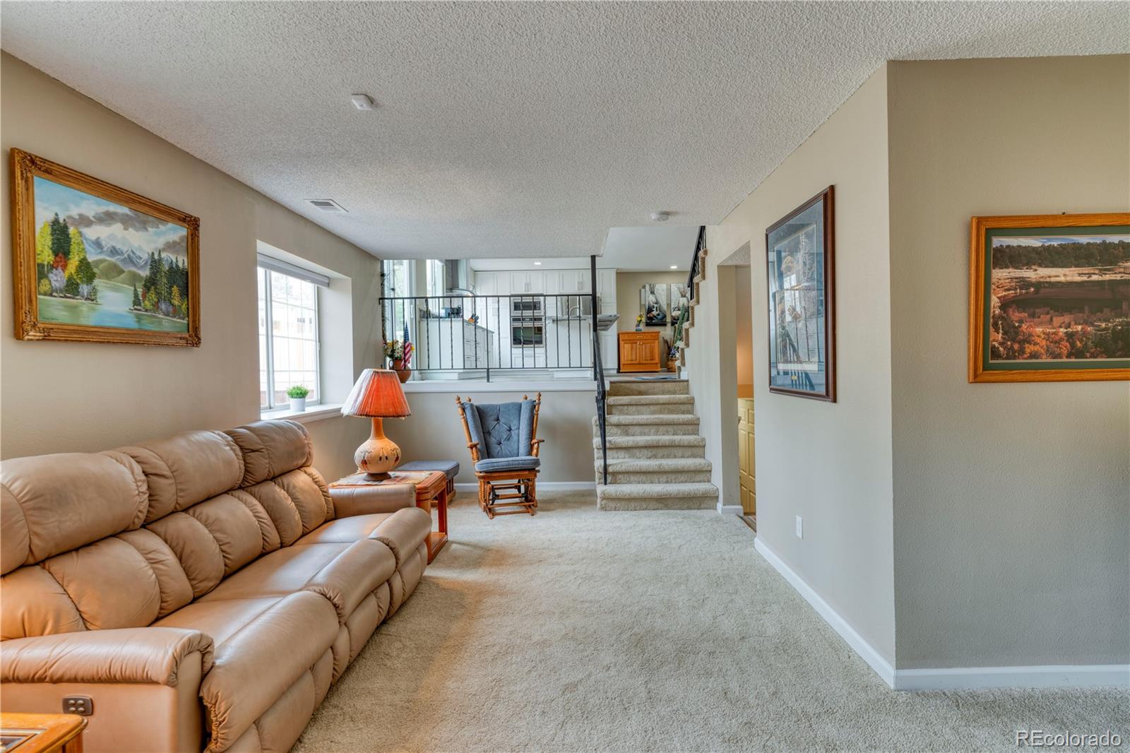 6723 East Rustic Drive Parker, CO 80138 - Photo 22 of 32 a living room with furniture and a view of bedroom