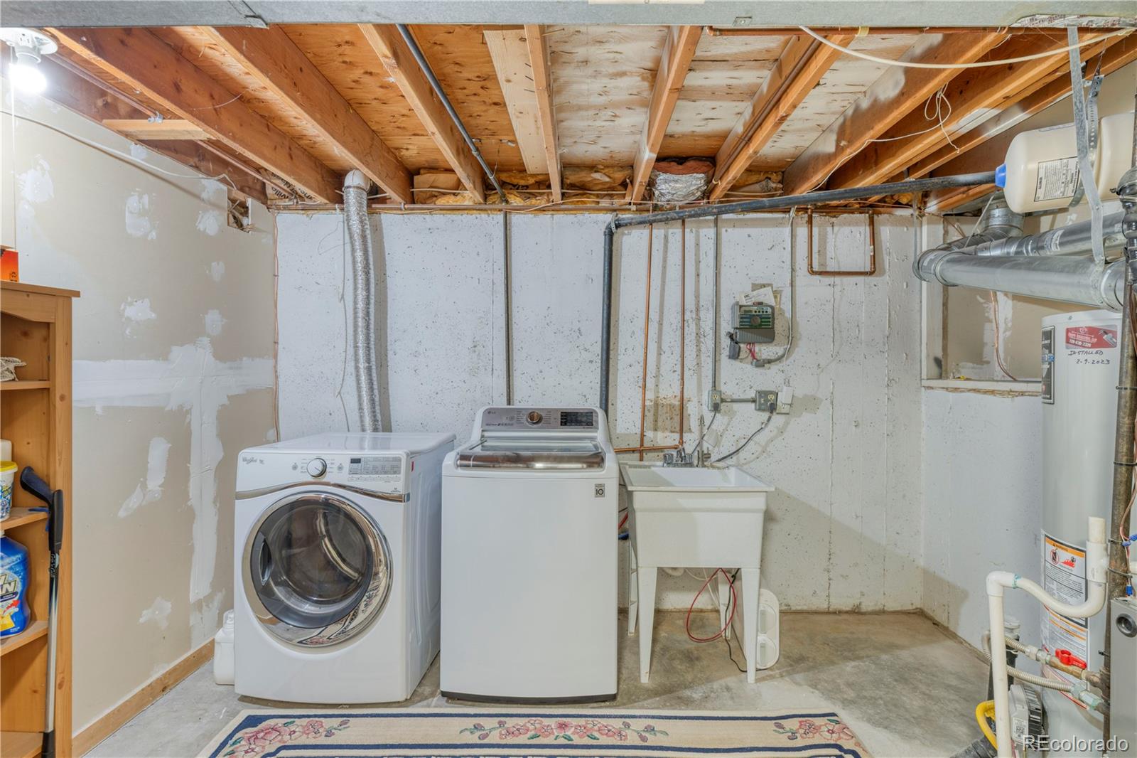 6723 East Rustic Drive Parker, CO 80138 - Photo 25 of 32 a utility room with dryer and washer