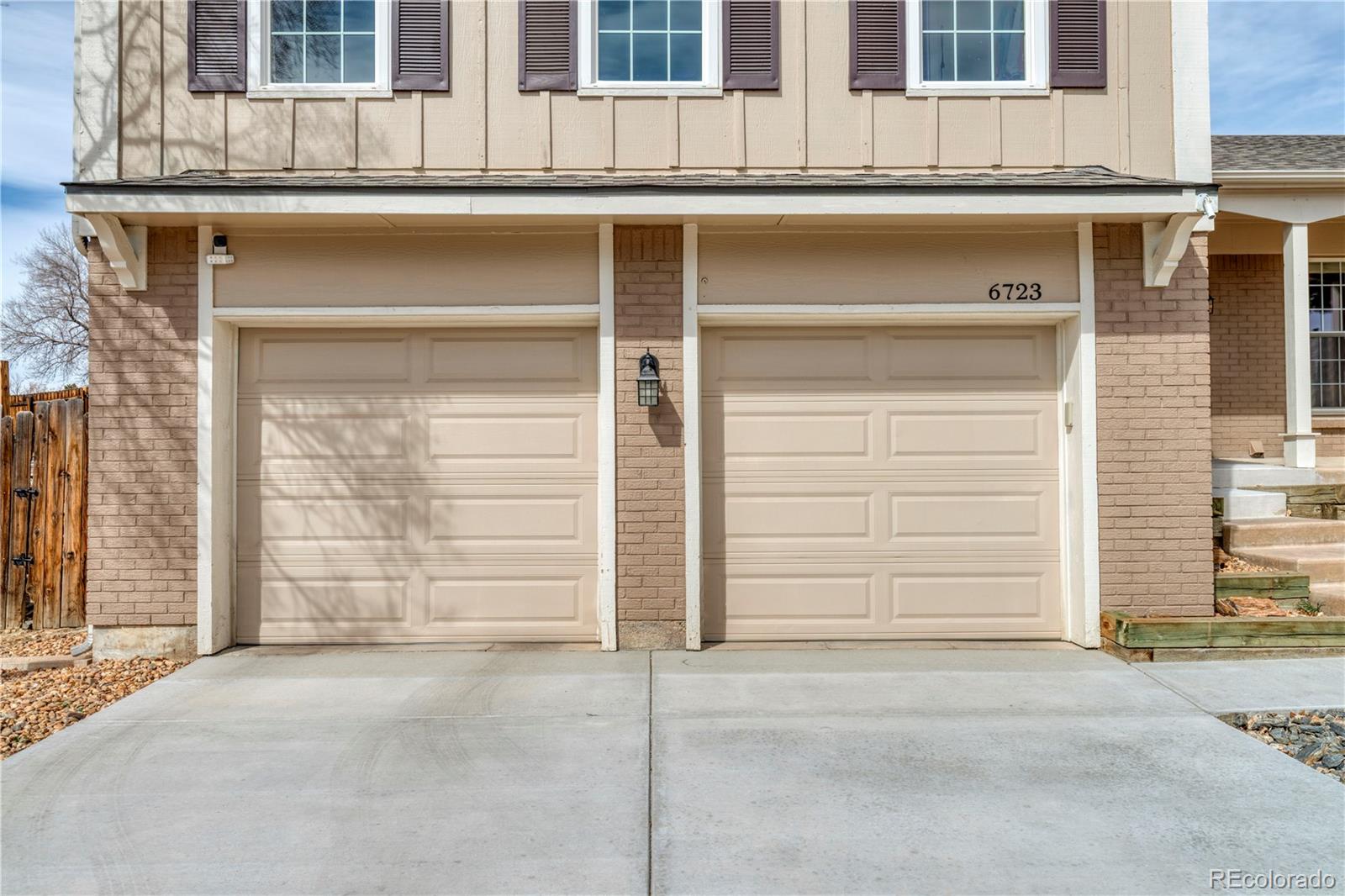 6723 East Rustic Drive Parker, CO 80138 - Photo 28 of 32 a front view of a house with a road