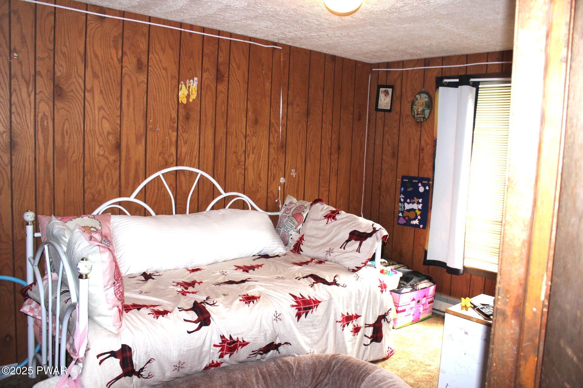 30 Brookfield Road, Unit LOT 1259 Lake Ariel, PA 18436 - Photo 10 of 32 a bedroom with a bed and a window