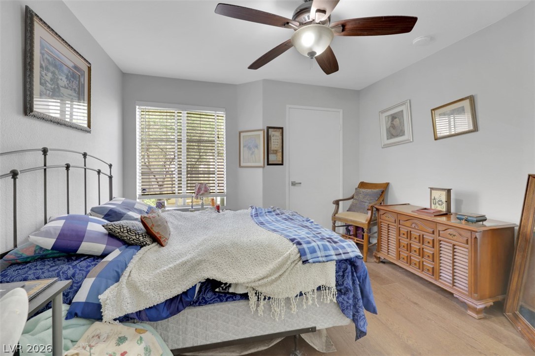 698 South Racetrack Road, Unit 1614 Henderson, NV 89015 - Photo 24 of 35 A comfortable bedroom with a warm ambiance and ample natural light from large windows.