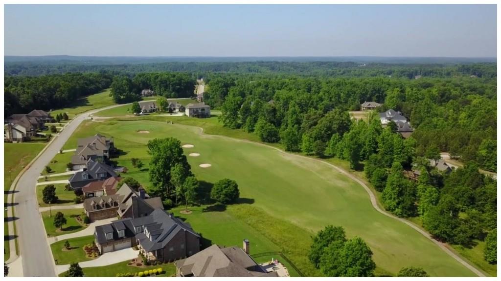 1472 Traditions Way Jefferson, GA 30549 - Photo 6 of 20 a view of a big yard with plants and large trees