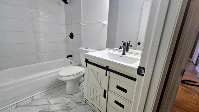 a kitchen with a sink cabinets and appliances