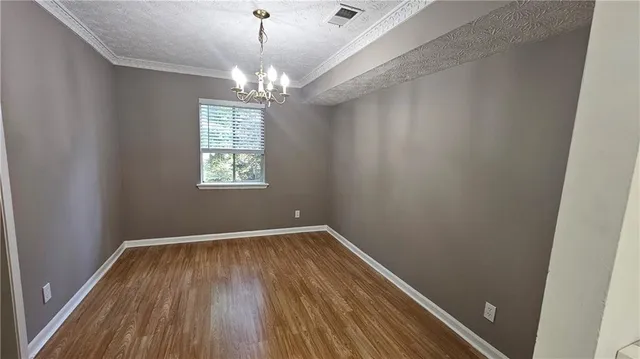 a kitchen with stainless steel appliances a stove a sink and a refrigerator