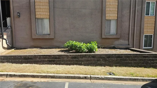 a view of hallway with wooden floor