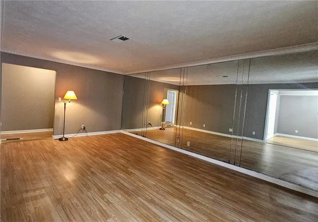 a view of a livingroom with a ceiling fan and window