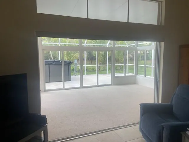 a living room with furniture and next to a window