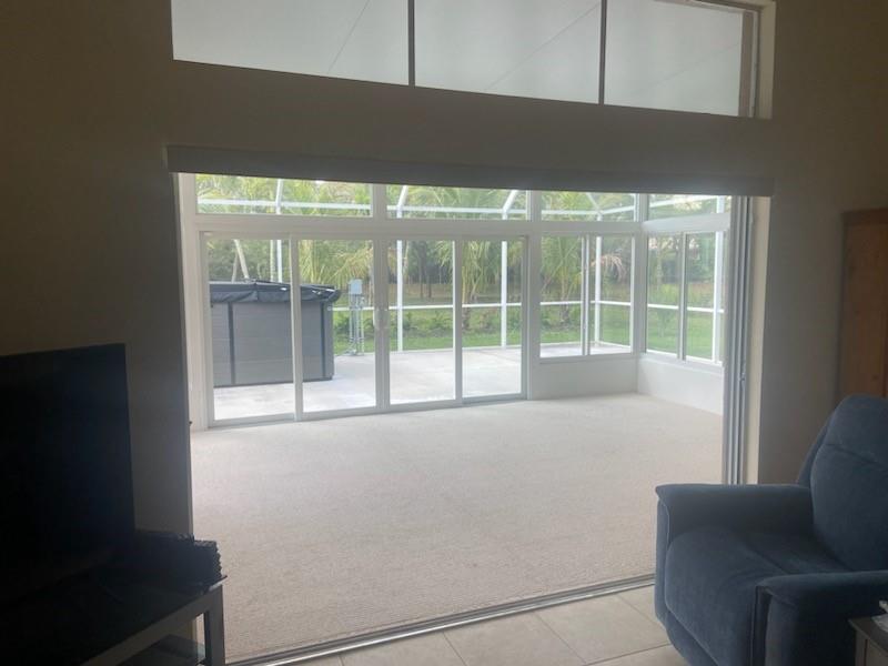 8121 Southwest Yachtsmans Drive Stuart, FL 34997 - Photo 13 of 30 LIVING OPEN TO FLORIDA ROOM