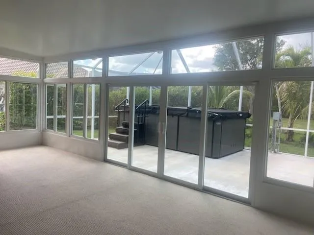 a view of an empty room with a balcony