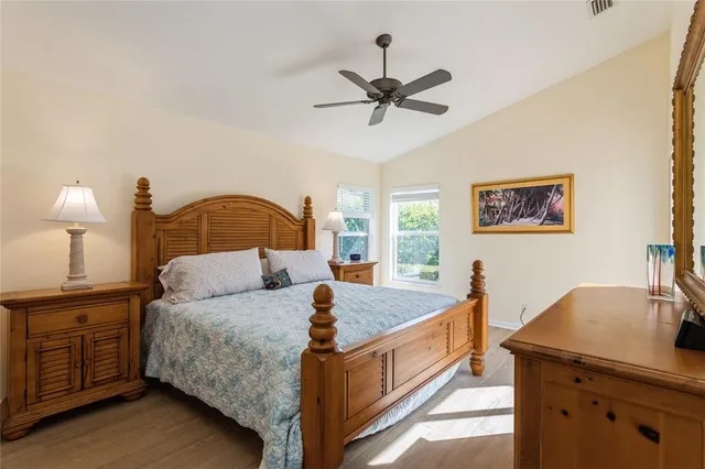 a bedroom with a bed and dresser