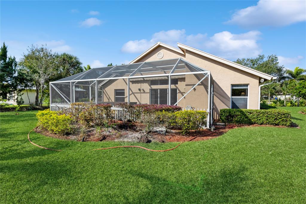 8121 Southwest Yachtsmans Drive Stuart, FL 34997 - Photo 24 of 30 Lanai before it was converted in a Florida Room