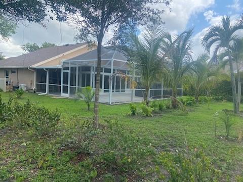 8121 Southwest Yachtsmans Drive Stuart, FL 34997 - Photo 25 of 30 New Florida room and screened lanai.