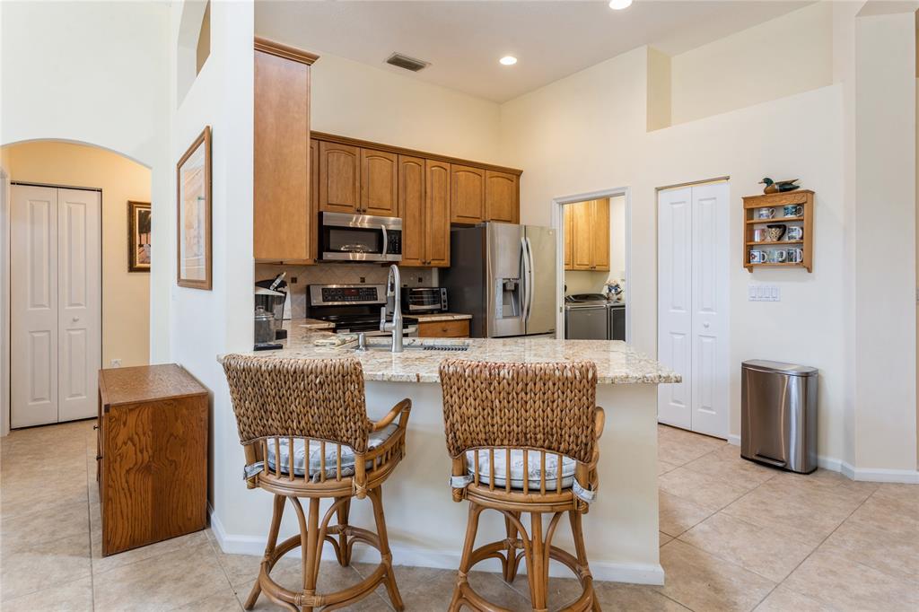8121 Southwest Yachtsmans Drive Stuart, FL 34997 - Photo 10 of 30 LAUNDRY ROOM AND GARAGE ACCESSIBLE FROM KITCHEN
