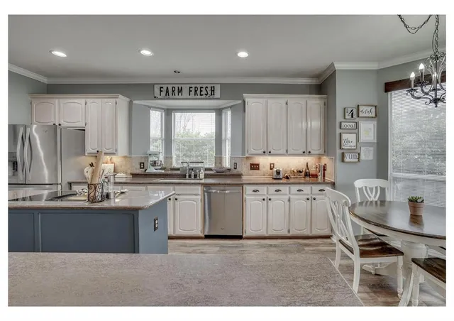 a kitchen with counter top space and appliances