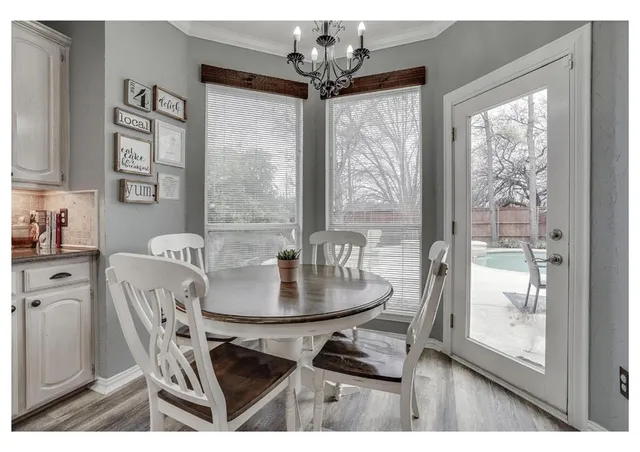 a dining room with furniture and window
