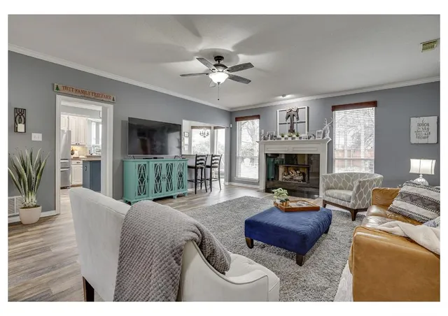 a living room with furniture and a fireplace